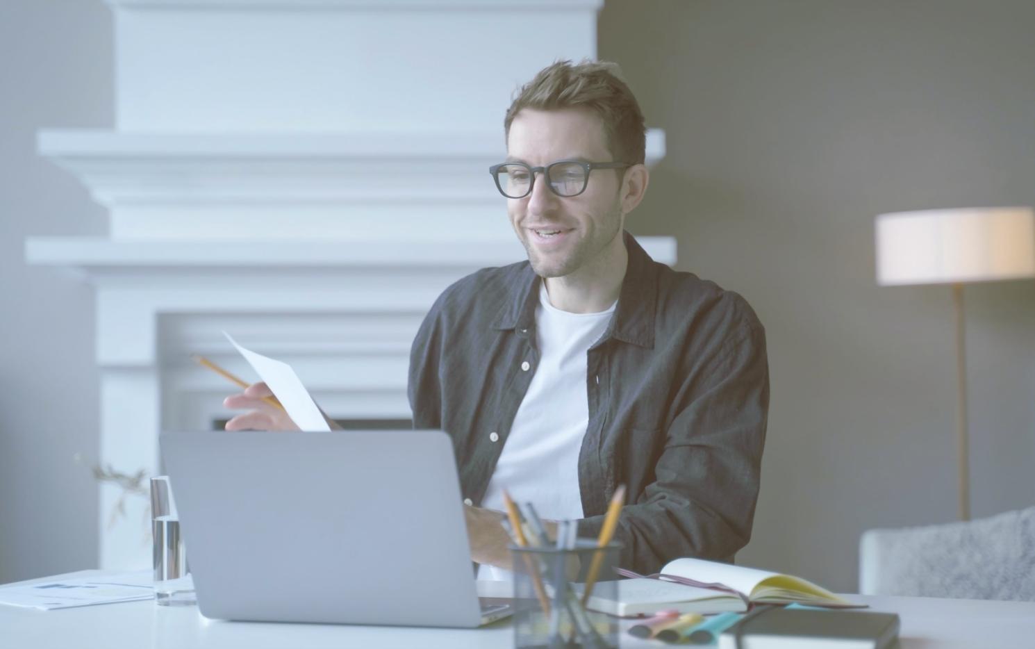 Developer working with VR headset and game engine development environment